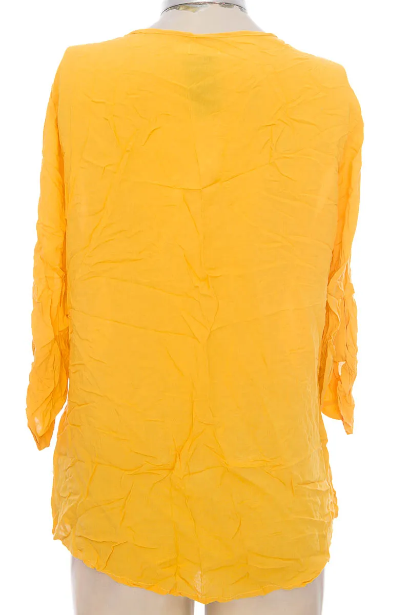 BLUSA COLOR AMARILLO  STOP