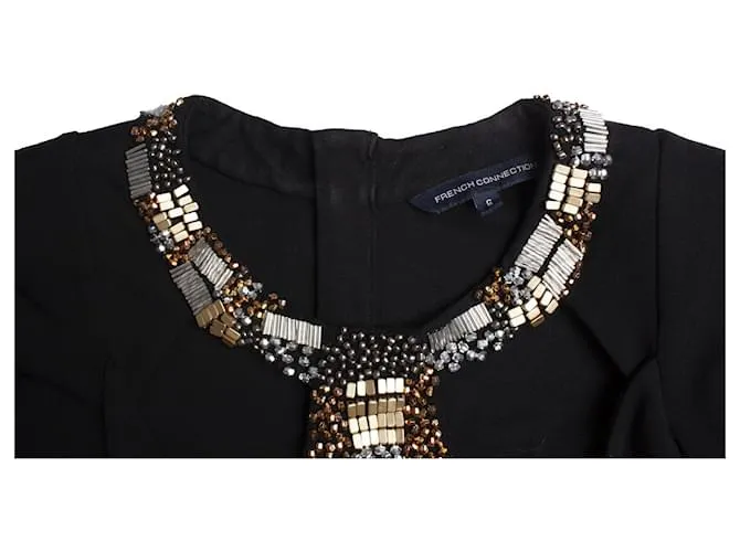French Connection Conexión francés, Vestido negro con adornos. 
