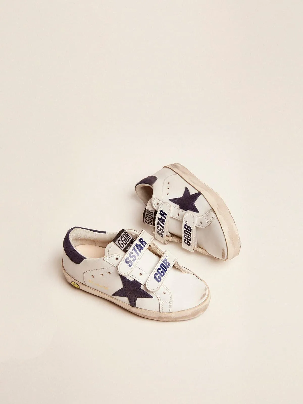 Old School Young de piel blanca con estrella y refuerzo del talón de ante azul