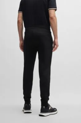 Pantalones de chándal en felpa de algodón con logo estampado en goma