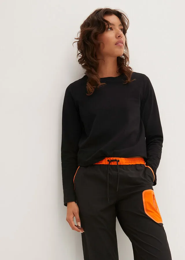 Pantalón elástico en 4 direcciones con material impermeable y bolsillos Negro