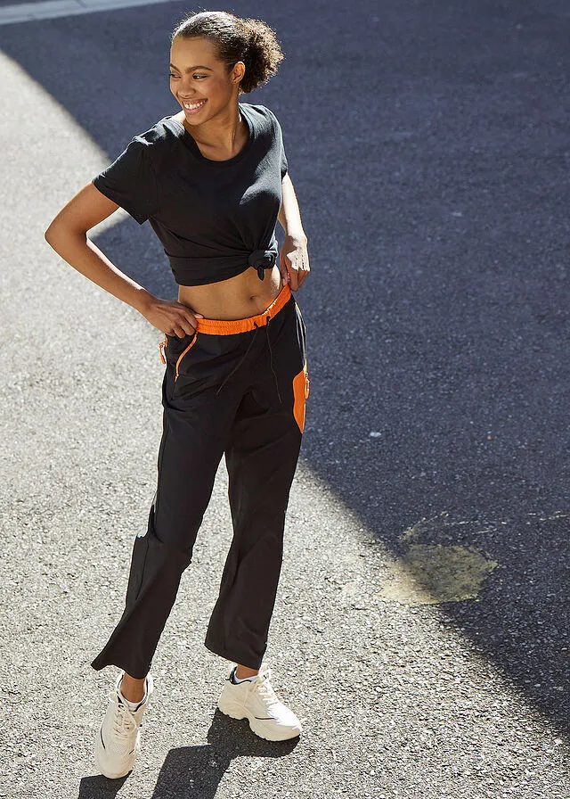 Pantalón elástico en 4 direcciones con material impermeable y bolsillos Negro