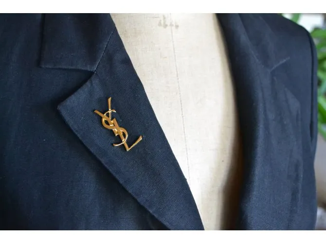 Yves Saint Laurent Broche Dorado 